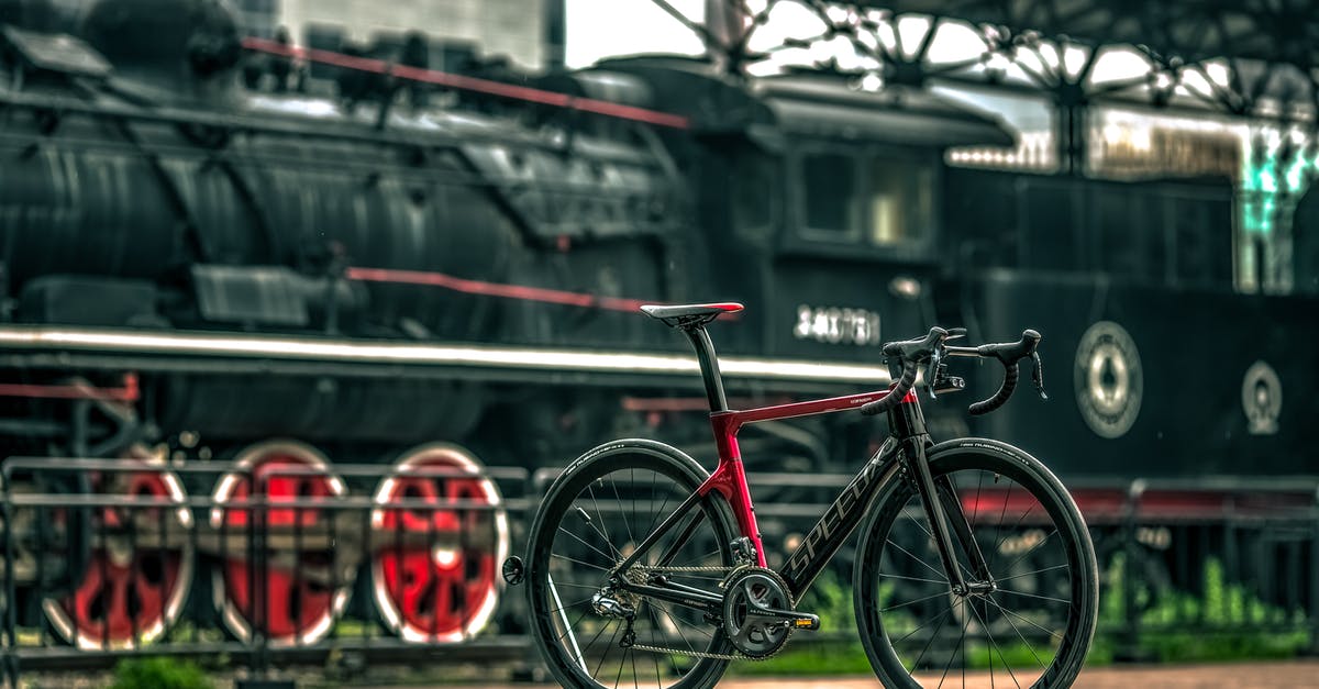 How do I access bicycle lockers at UK train stations? - Black And Red Road Bike Near Black Train