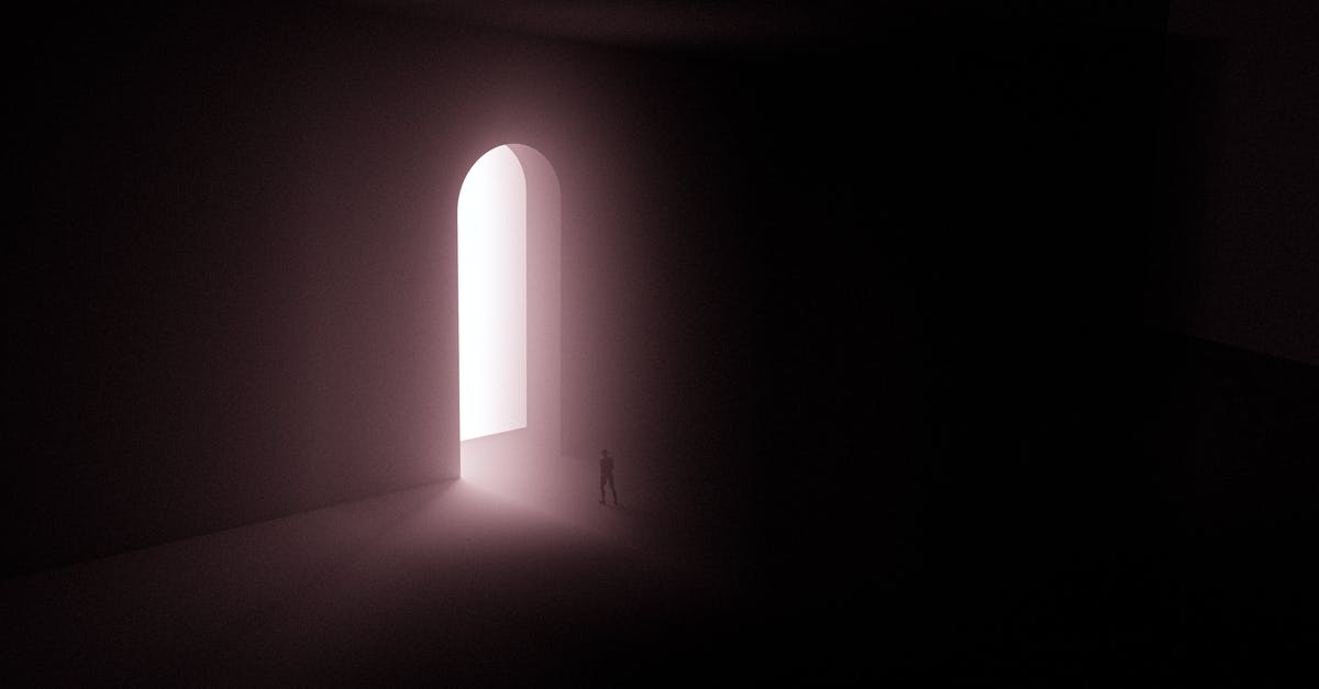 How do I get an invitation to enter Kosovo? - Silhouette of Person Standing Near A Doorway With Bright Light 