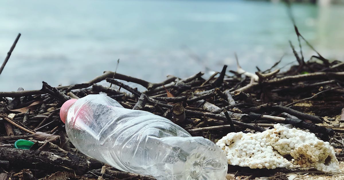 How do I minimise waste on a flight? - Close-Up Photo of Plastic Bottle