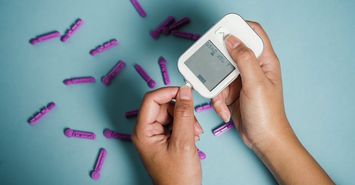 How do I prevent damage to electronic devices at airport security? - Top view of crop anonymous female diabetic measuring blood sugar with glucometer over scattered lancets How do I prevent damage to electronic devices at airport security? - Top view of crop anonymous female diabetic measuring blood sugar with glucometer over scattered lancets