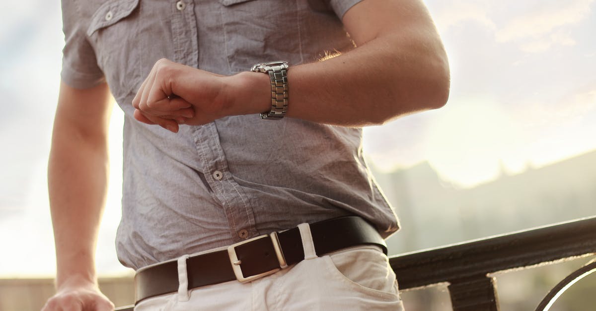 How do taxis in Bangkok charge for waiting time? - Man Showing Wristwatch