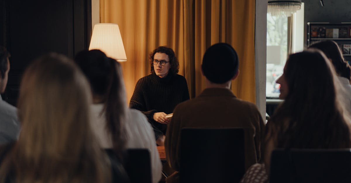 How do tour companies book flights and hotels? [closed] - People Sitting on Chair in Front of Table