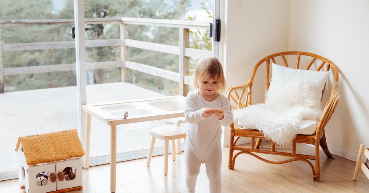 How do you seat a baby securely on a coach transfer? - Girl Playing In The Living Room