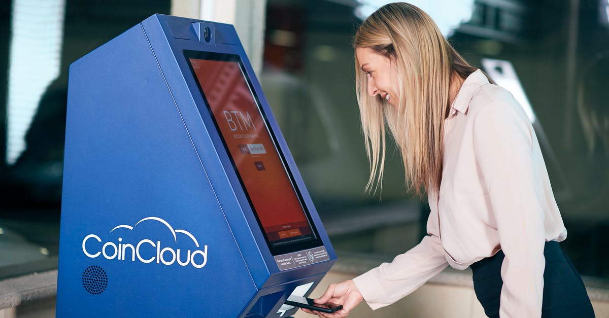 How do you use ATM machines abroad? [closed] - Woman in Formal Wear using ATM