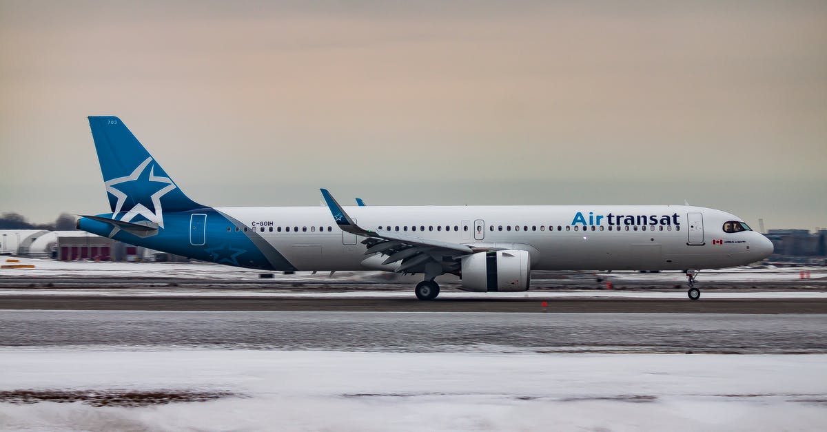 How does a hurricane making landfall between departure and destination affect air travel? - Passenger aircraft moving on airfield after landing in airport during sunset on winter day How does a hurricane making landfall between departure and destination affect air travel? - Passenger aircraft moving on airfield after landing in airport during sunset on winter day