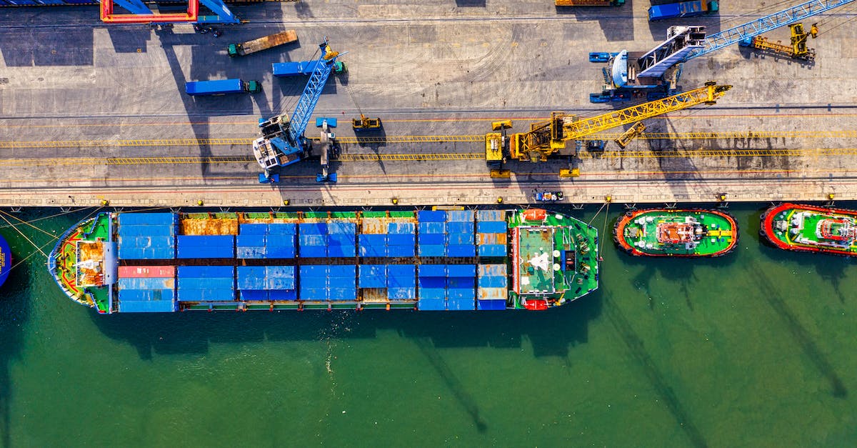 How does customs work if my layover is in a third country? - Aerial Photography of Cargo Ship