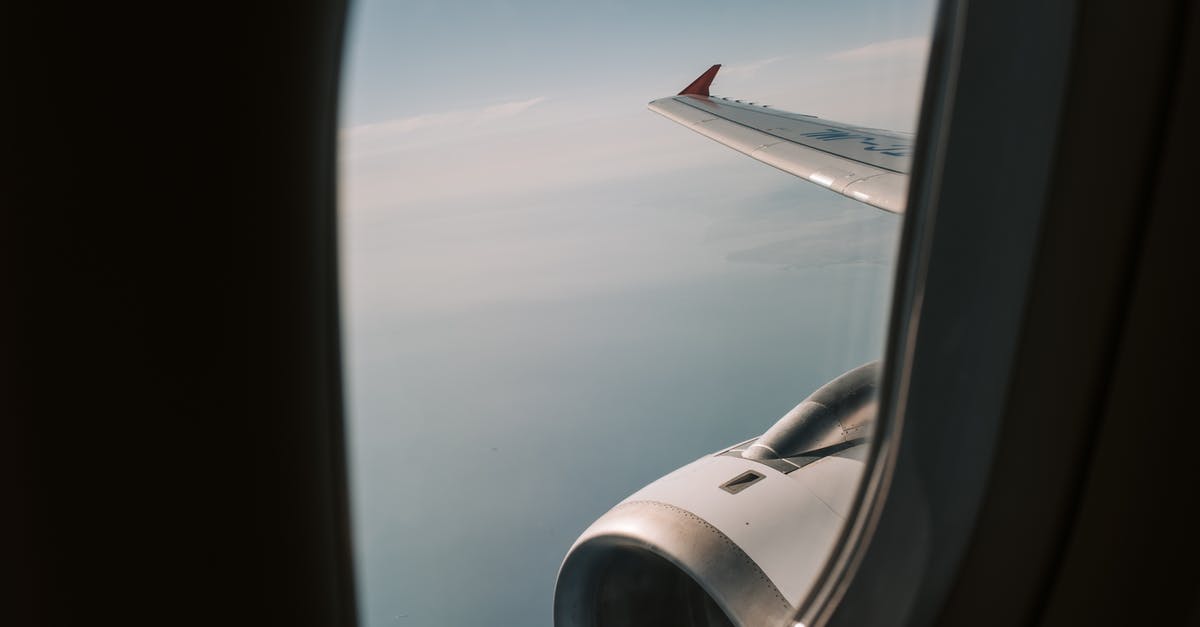 How does flying at high altitude affect the taste of wine? - View Of The Clouds From An Airplane Window