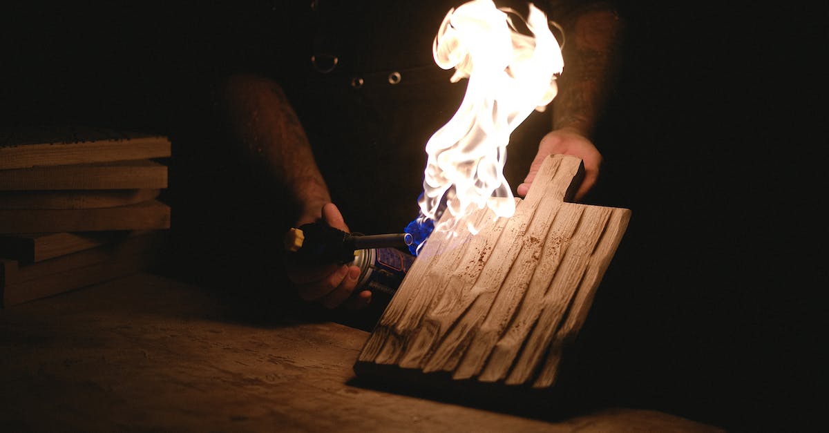 How does full-service gas work in Oregon? - Crop craftsman burning wooden board