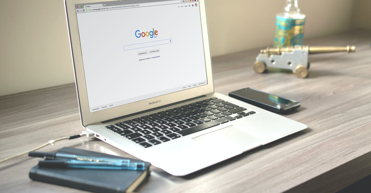 How does Google Flights define classes? - Macbook Air on Grey Wooden Table