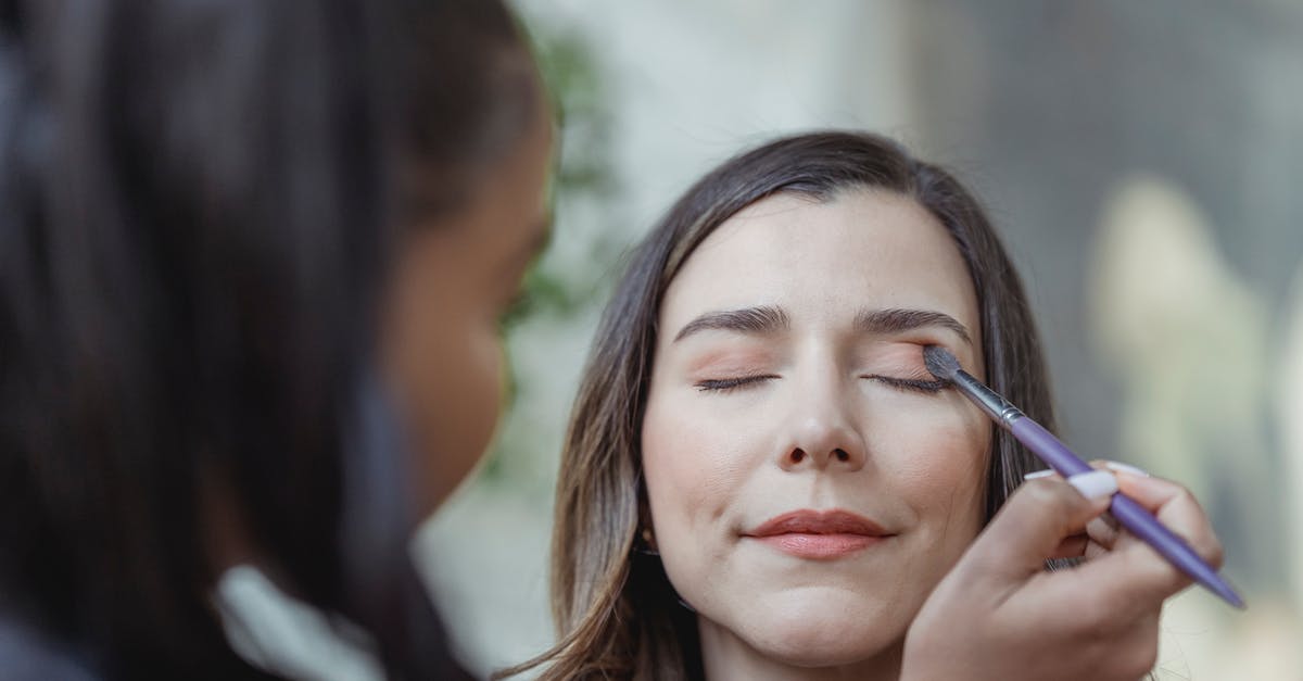 How does Schengen 90/180 apply to long-stay visas? [duplicate] - Young black visagiste applying eyeshadow on eyelids of female customer