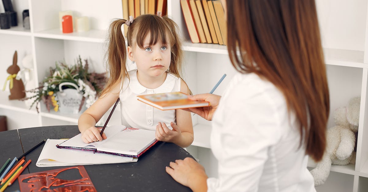 How early should I book hotels in North-Eastern Mediterranean? - Cute schoolchild doing homework with help of tutor