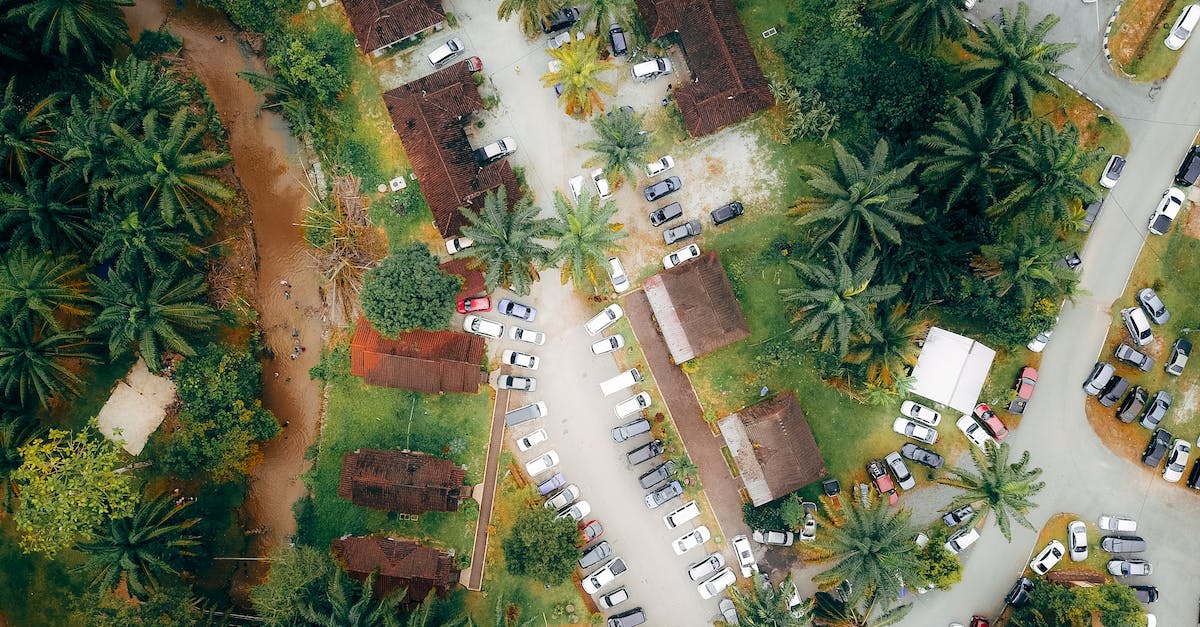 How effective is a valet key at a hotel parking garage? - Roofs of villas with parked cars in exotic resort