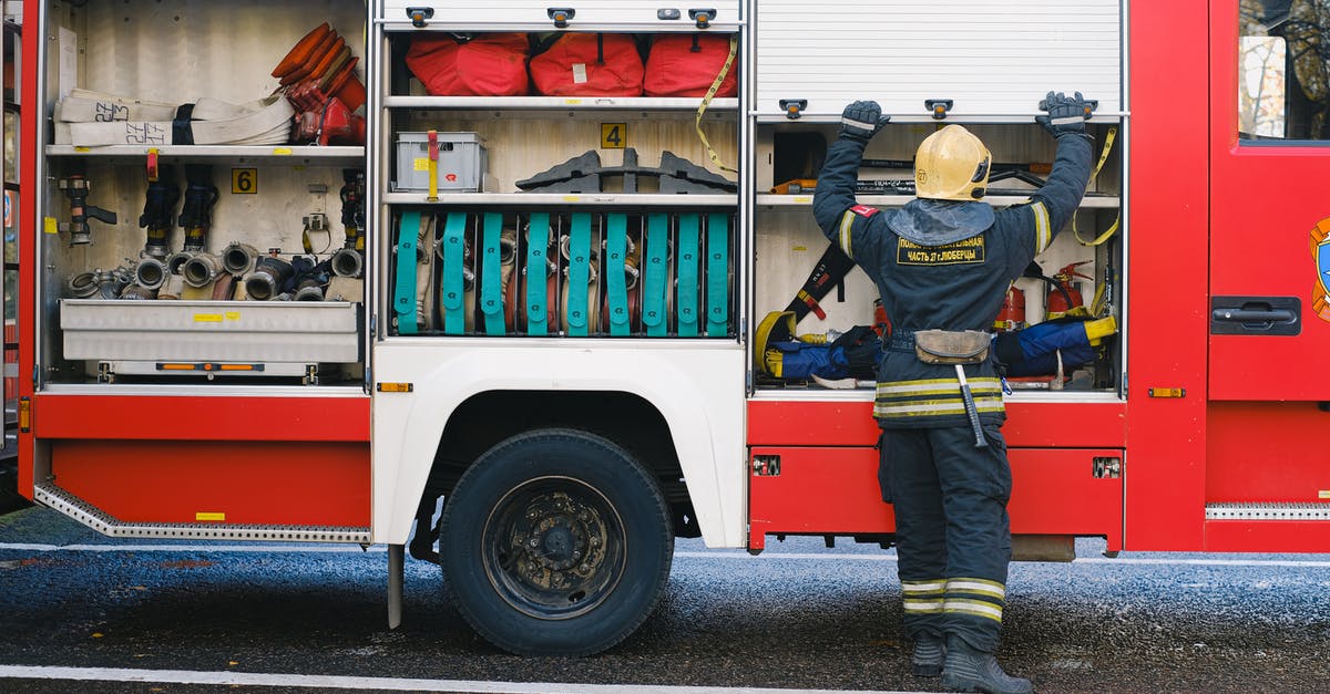 How efficient is the immigration service at Oakland? - Firefighter in Uniform near Vehicle