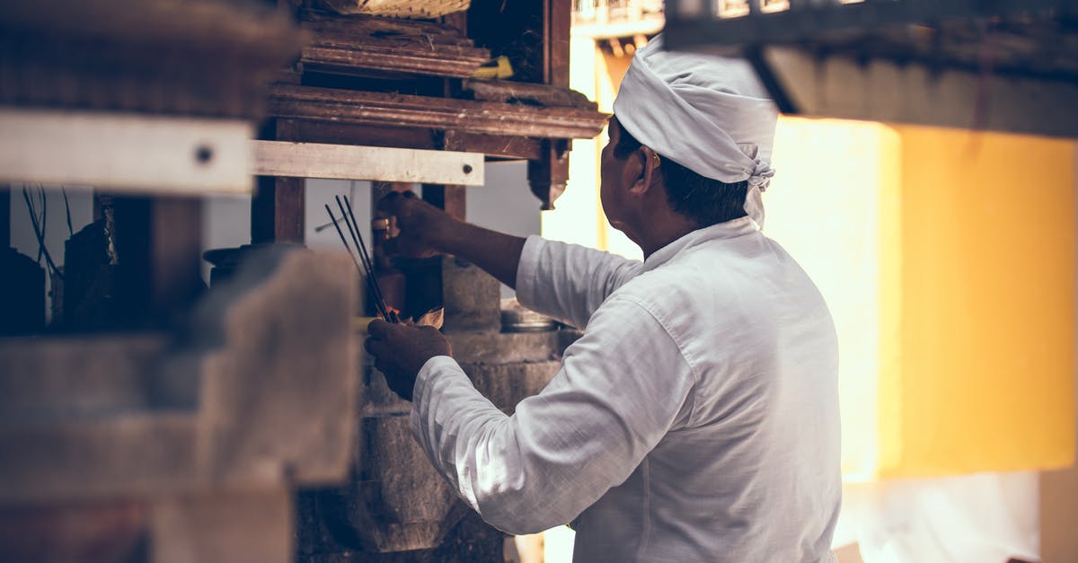 How exactly does travelling to Bali work now? - Photography of Man on Kitchen Room