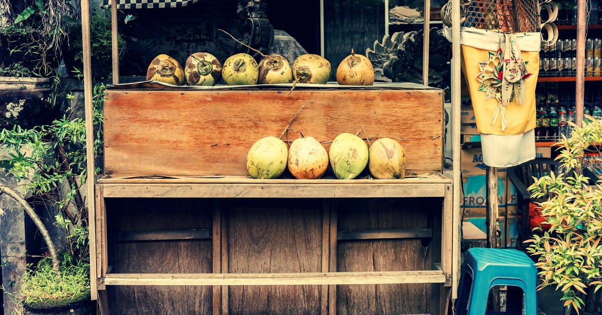 How exactly does travelling to Bali work now? - Photo of Store Selling Coconuts