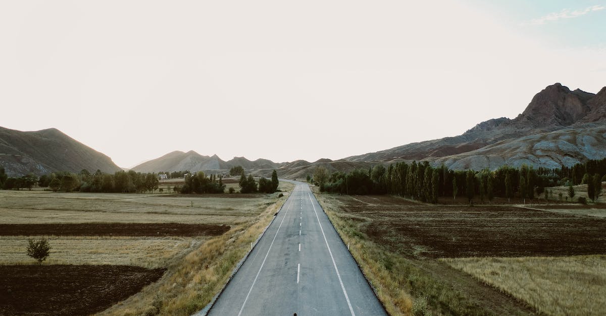 How far in advance to get travel vaccinations? - A Person Standing Alone on Country Road