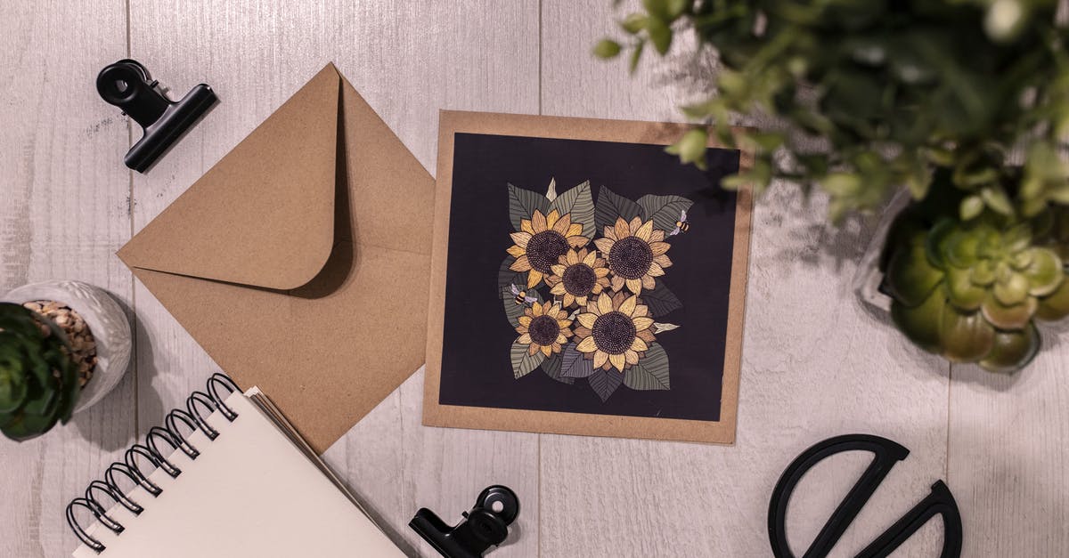 How long does it take to send postcard from Germany to India - Postcard and notebook on table near green plant How long does it take to send postcard from Germany to India - Postcard and notebook on table near green plant