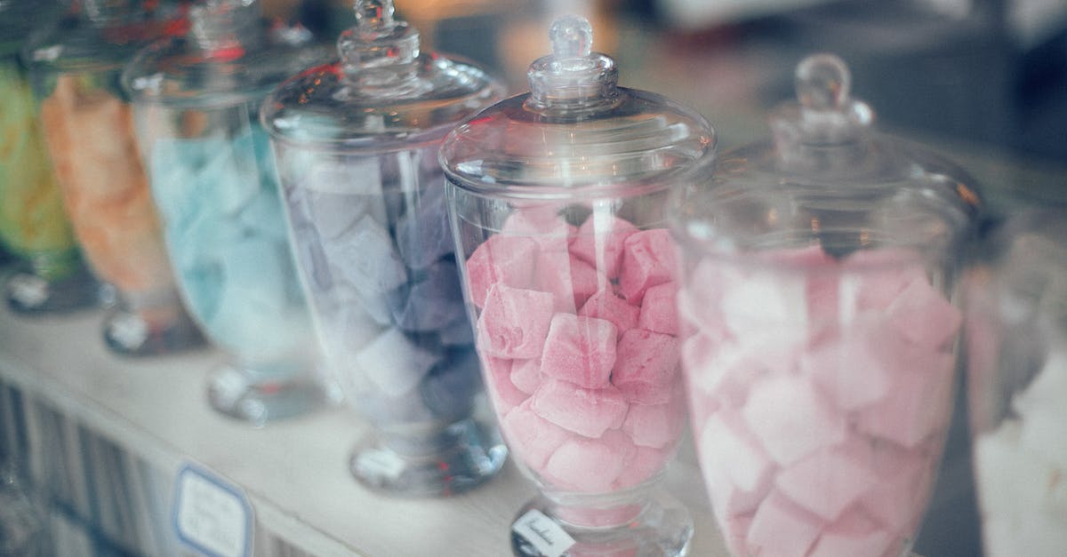 How many hours are on a transit visa through Canada? - Assortment of various multicolored sweets on counter in store