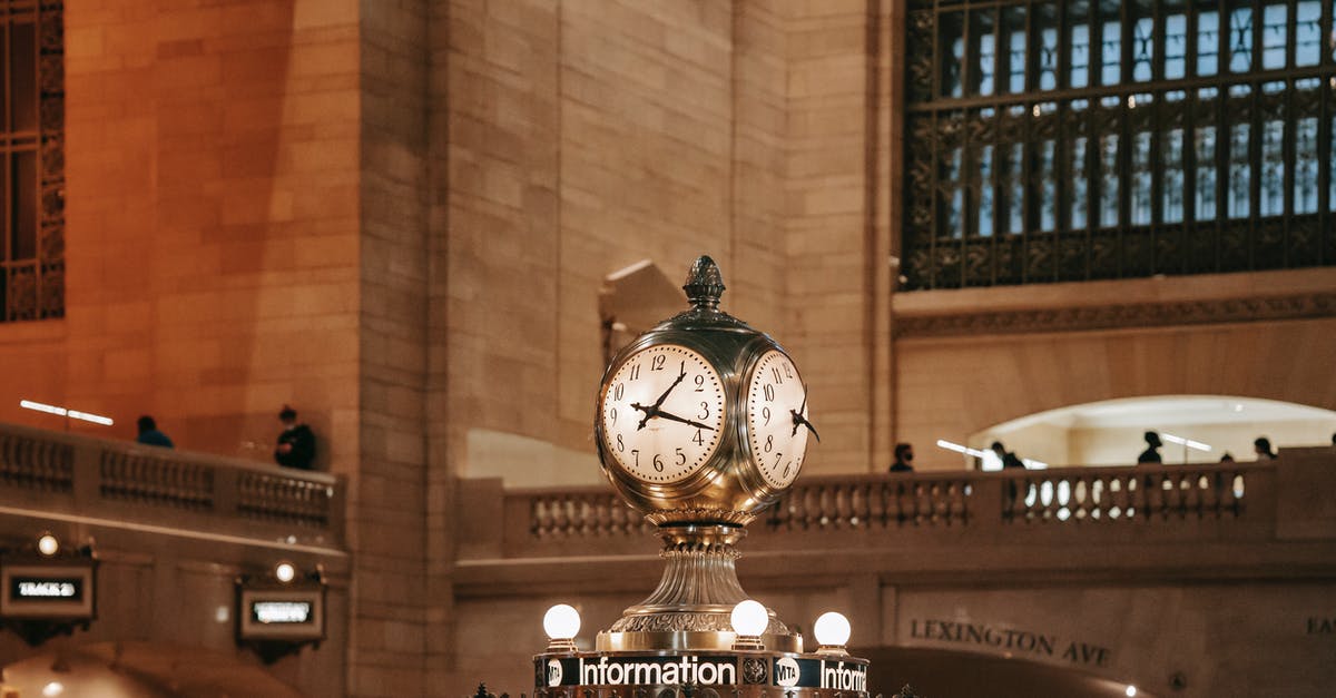 How many hours are on a transit visa through Canada? - Railway station with clock in classic building