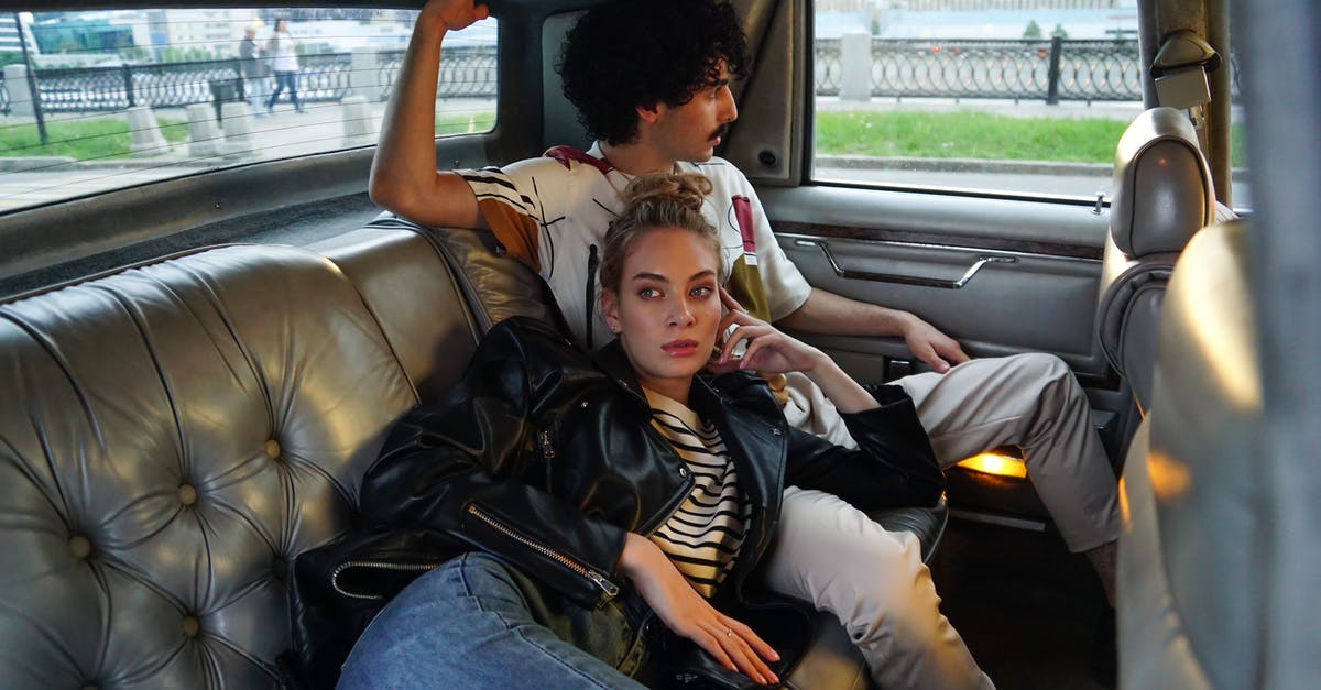 How many passengers allowed in a car in Oklahoma, USA? - A Man and Woman Sitting on a Leather Car Seat