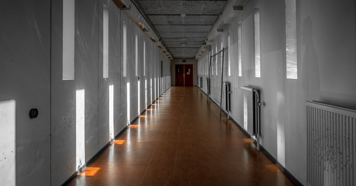 How much does the train between Hendaye and San Sebastian cost? - Empty Interior of Passage Between Buildings