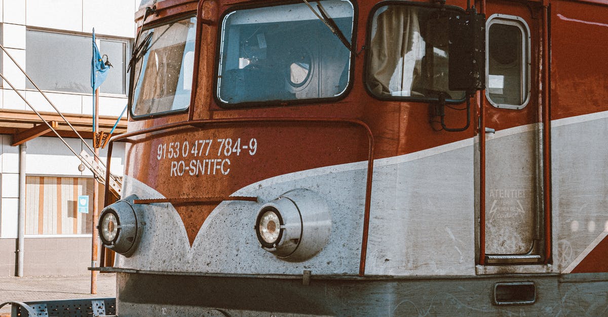 how much is Vietnam train ticket? [closed] - Red and Brown Train in a Train Station