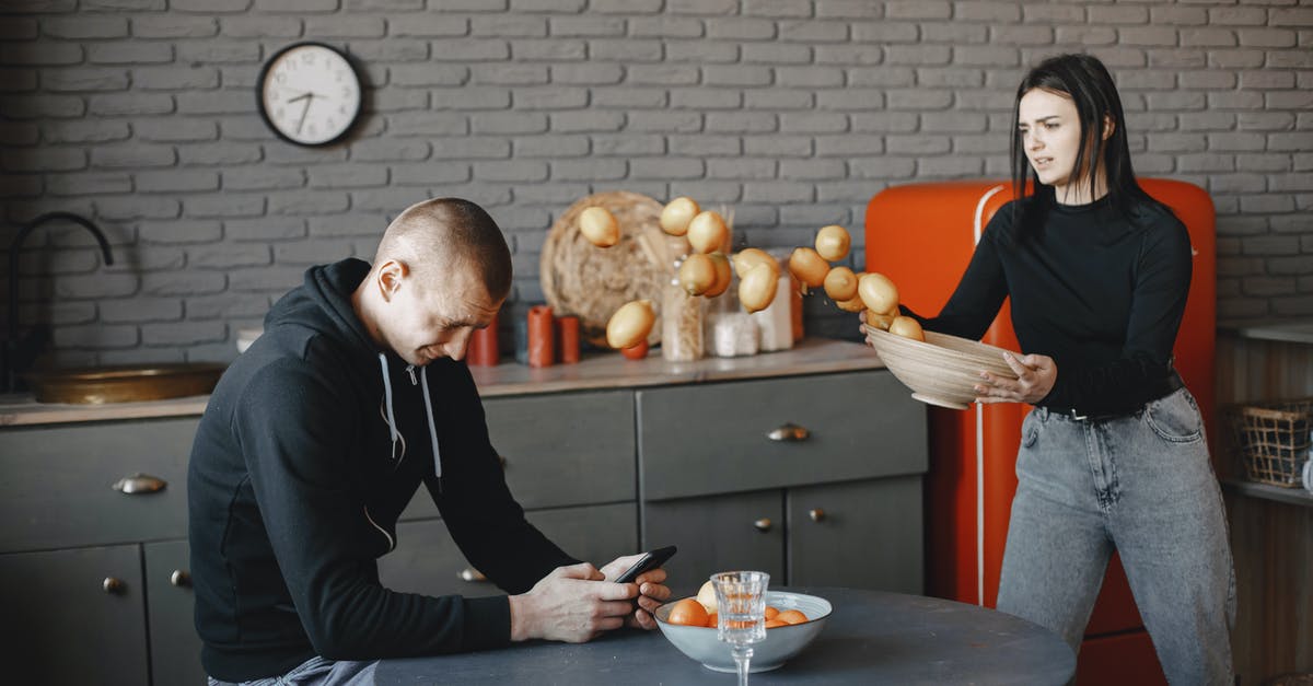 How severe will language problem be in Germany? - Man in Black Sweater Sitting on Chair