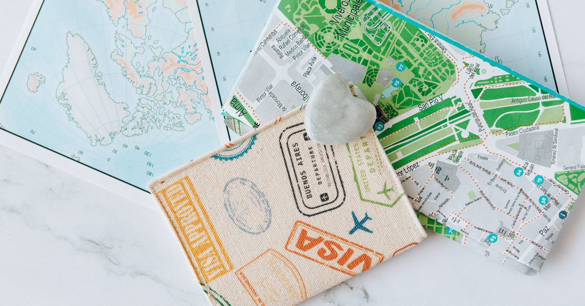 How should the question "Have you ever been issued a passport or ID for travel by any other country" for previous green card holders be answered? - Free stock photo of accessories, achievement, adventure