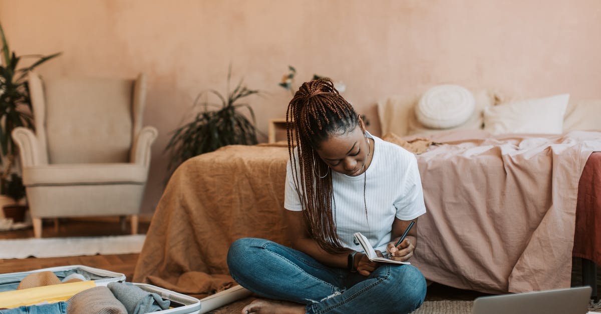 How to avoid taking bed bugs along with the luggage - Woman Writing on a Notebook 