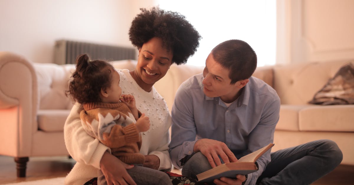 How to book a ticket for an unborn infant? - Photo of Man and Woman Having Fun With Their Baby