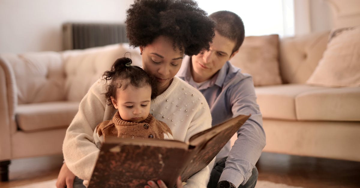 How to book a ticket for an unborn infant? - Photo of Woman Holding Brown Book With Her Child