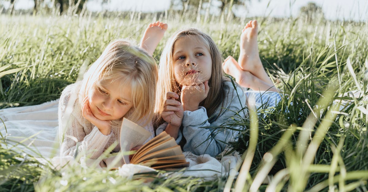 How to book flights with multiple stop-overs of several days? - Little Girls Lying on Green Grass Field