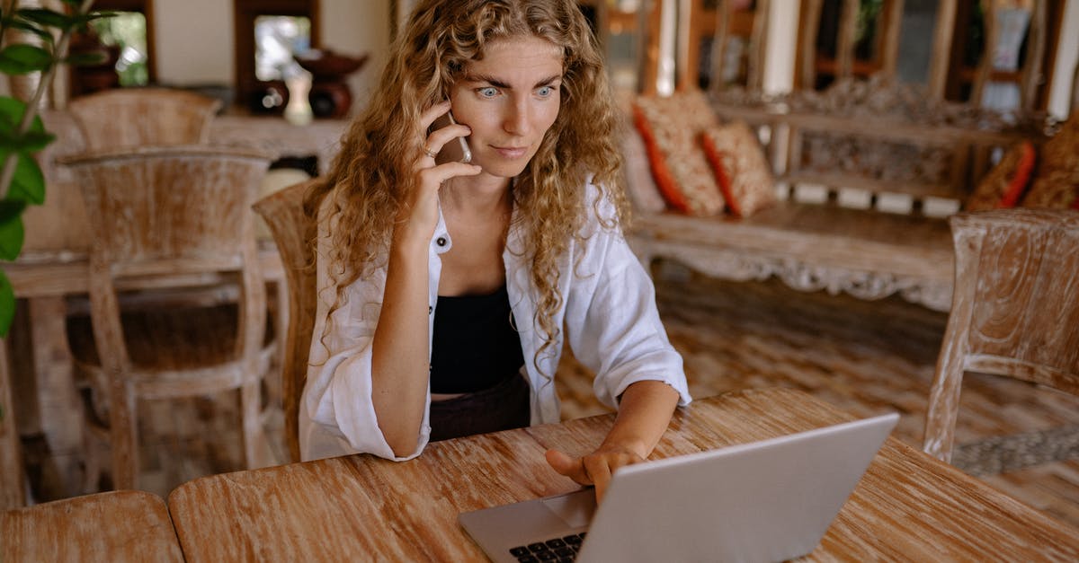 How to bring big electronics in aeroplane? [duplicate] - Photo of Woman Using Smartphone and Silver Laptop