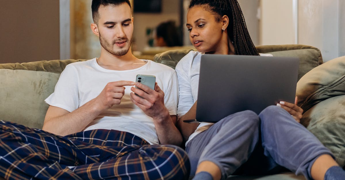 How to bring big electronics in aeroplane? [duplicate] - Man in White Crew Neck T-shirt Sitting Beside Man in White Crew Neck T-shirt