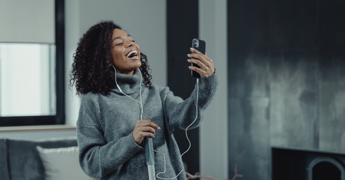 How to cancel an ADO online reservation? - Woman in Gray Sweater Holding Black Smartphone