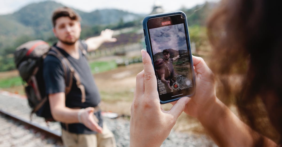 How to change my Indian Railway boarding point online? - Female taking video of traveler during hike in countryside in daylight