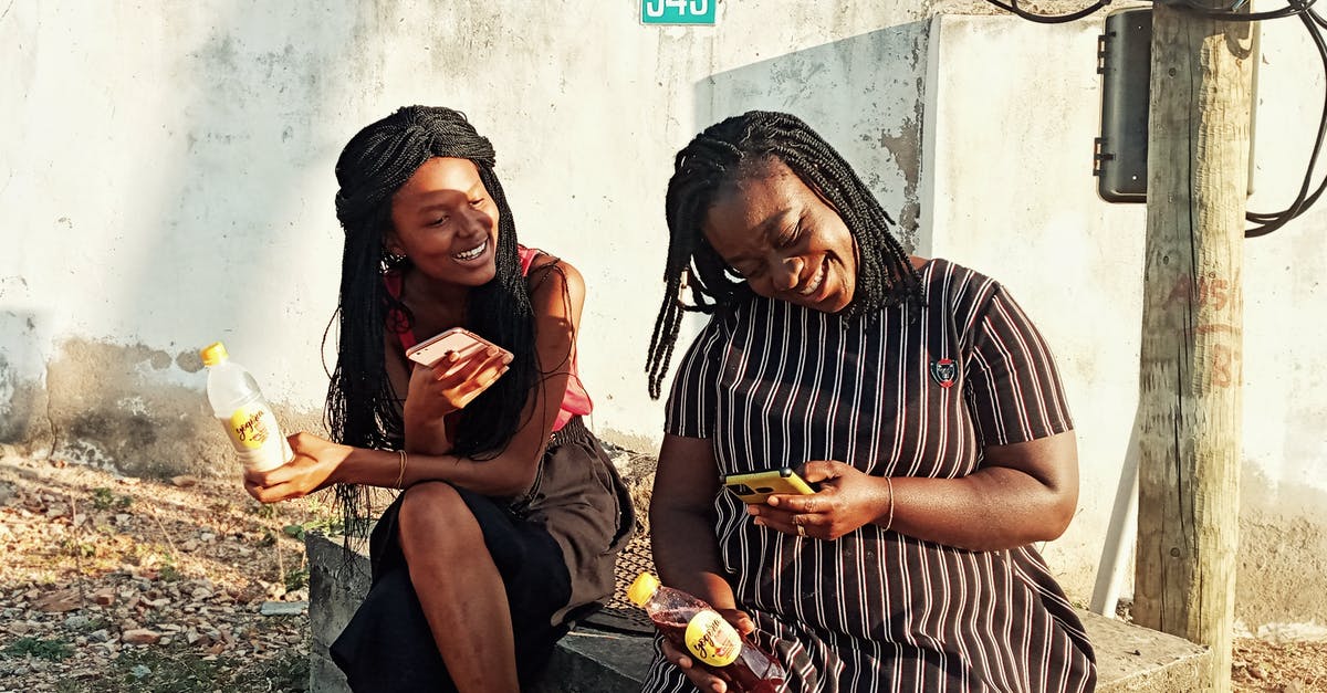 How to contact border authorities in EU/Schengen countries? - Black women sitting on stone curb