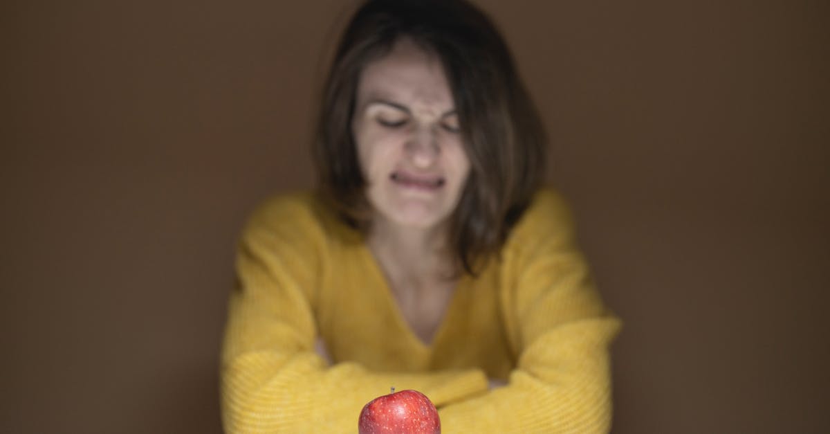 How to cope with disgusting fellow travellers? - Woman Disgusted Looking at the Apple