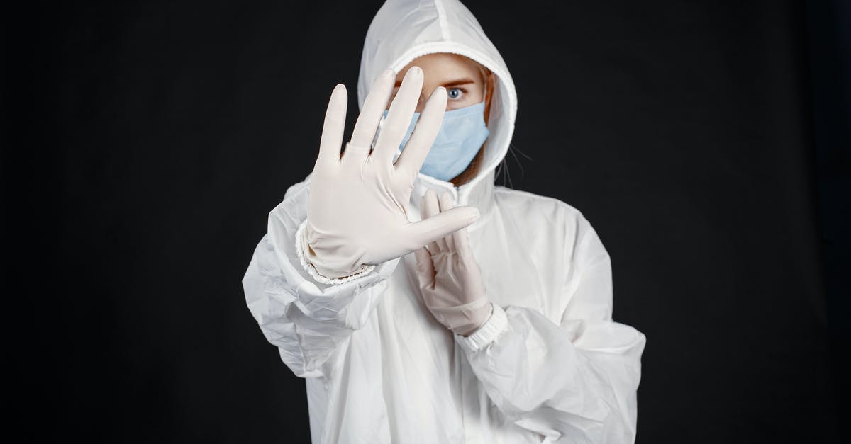 How to deal with a fear of driving? - Person in Protective Suit against Coronavirus