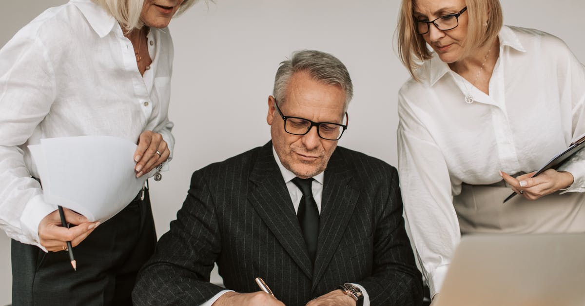 How to deal with too short transfer interval? - Man in Black Suit Jacket Sitting Beside Woman in White Dress Shirt