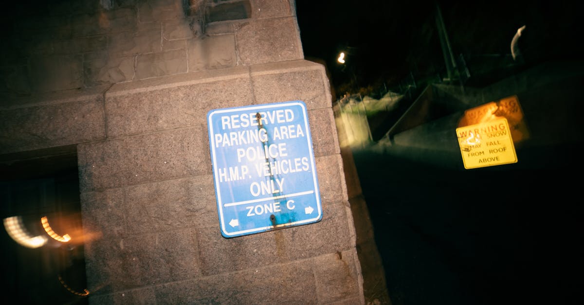 How to decipher no parking signs? (UK) - Signboard restricting parking for cars on reserved area for police vehicles at night