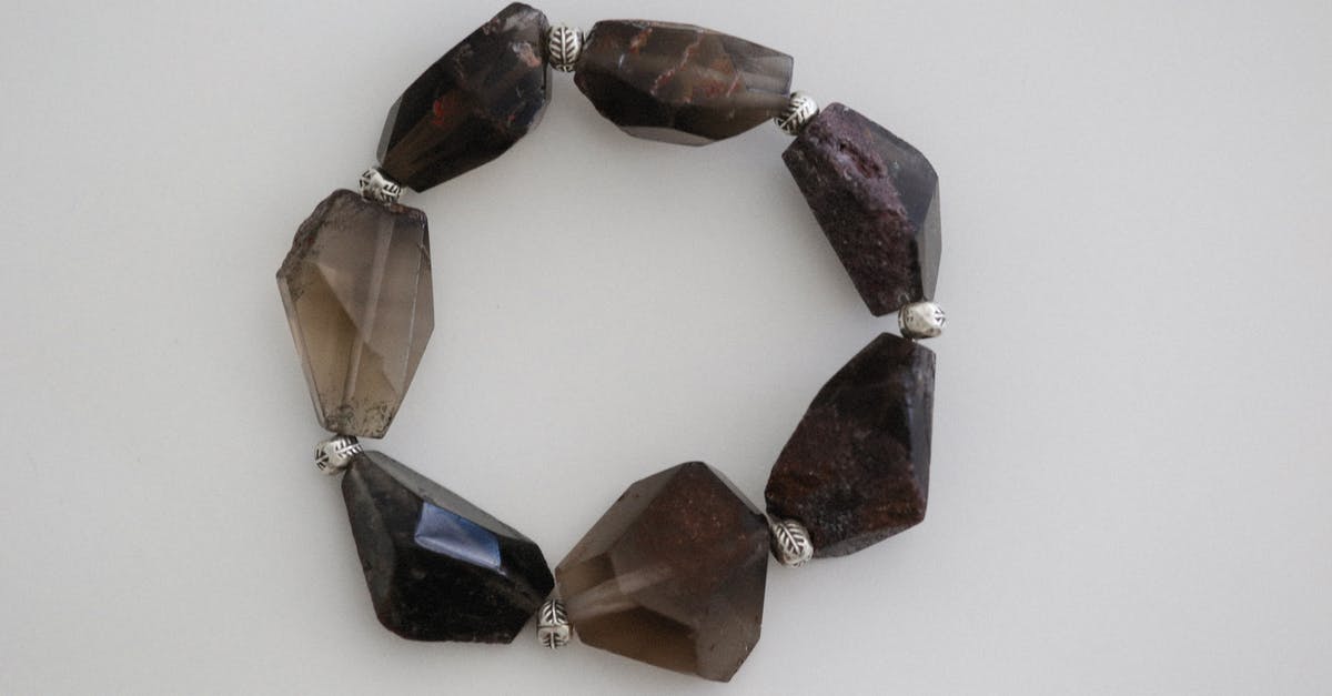 How to discover hidden gems beyond the "top 10" attractions? [closed] - Stone Bracelet on White Surface