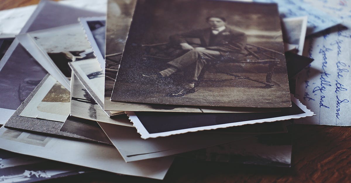 How to document travel expenses? - Man Sitting on Black Chair Grayscale Photo