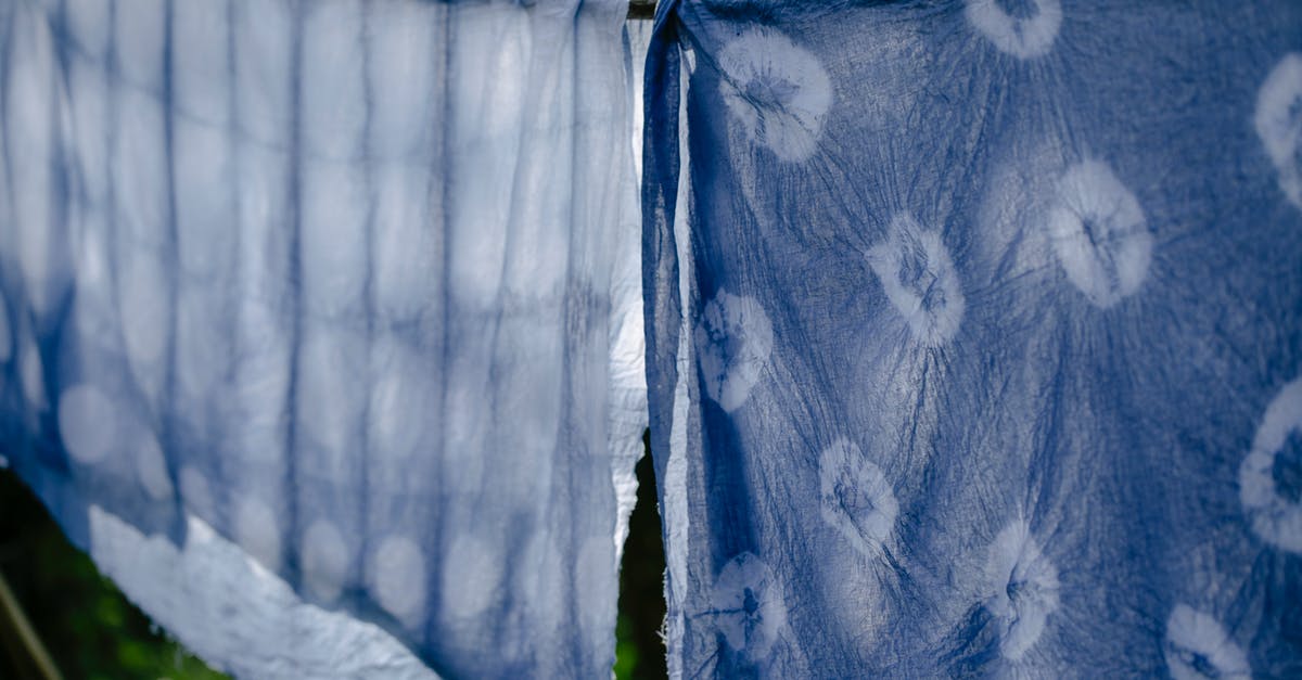 How to dry out a wet passport? - Clean fabric drying on clothesline on sunny day