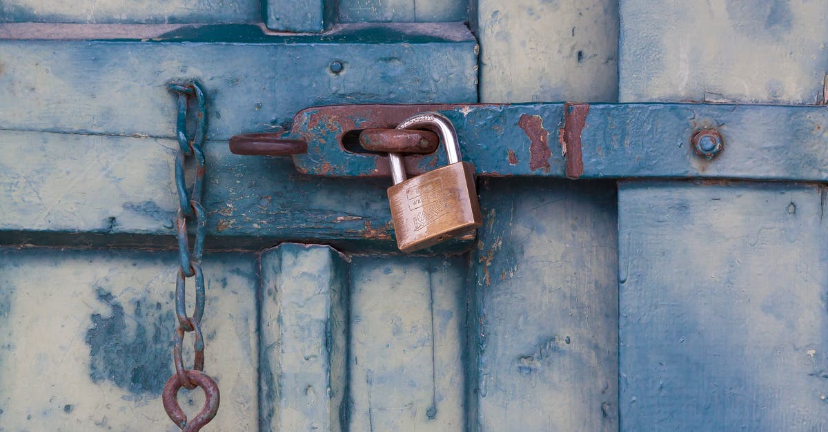 How to ensure privacy and safety in hotels of India? - Gold Padlock Locking Door