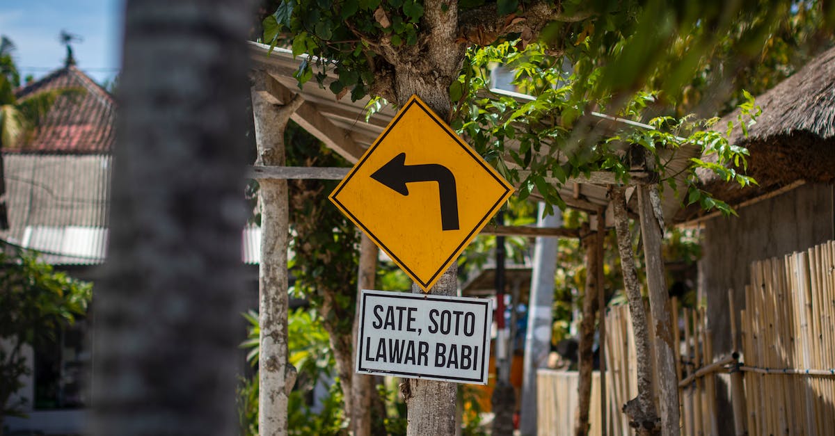 How to extend Indonesian visa on arrival (VOA) in Indonesia - Yellow  Left Turn Sign