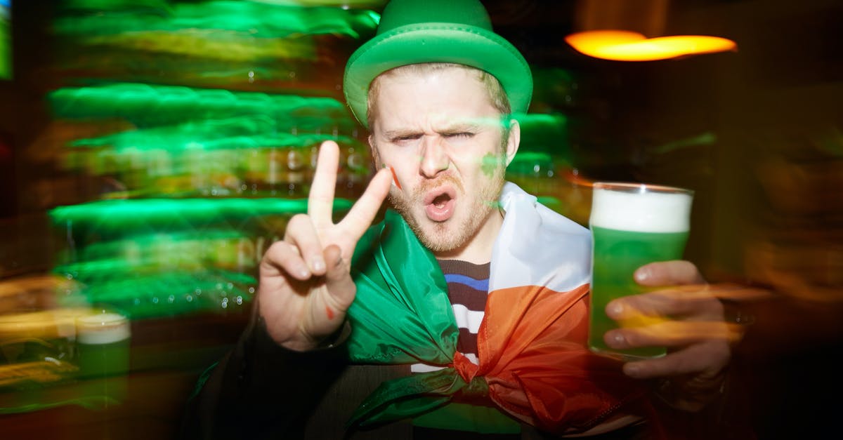 How to extend my national visa in Poland by one day? - Man Holding a Green Drink