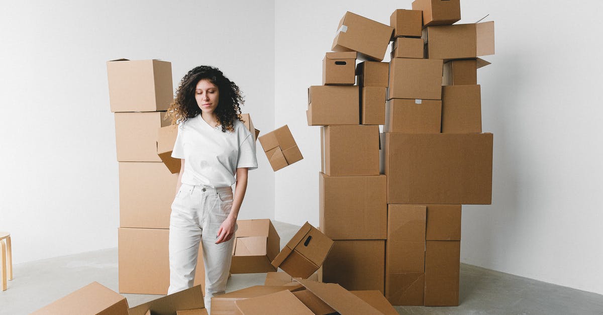 How to fly on the new Boeing 787 Dreamliner? - Woman between heaps of carton boxes in new house