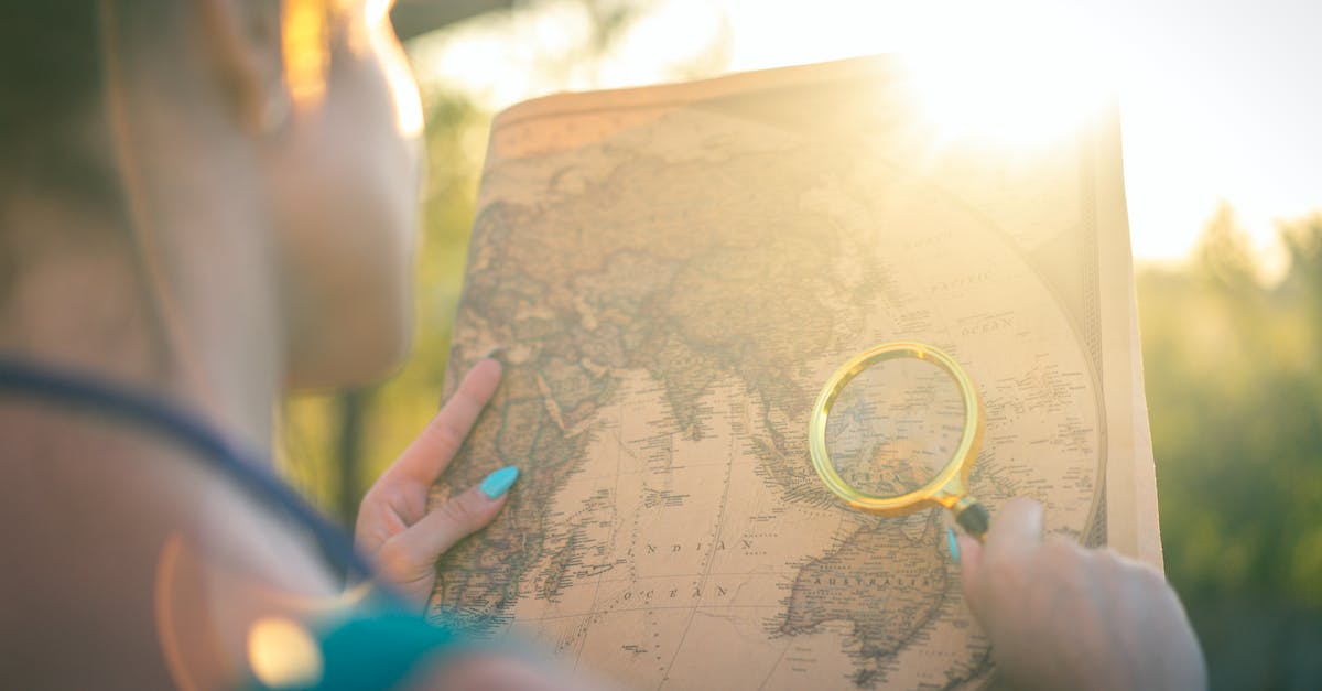 How to generate a travel map? - Person Holding Brown and Black Floral Textile