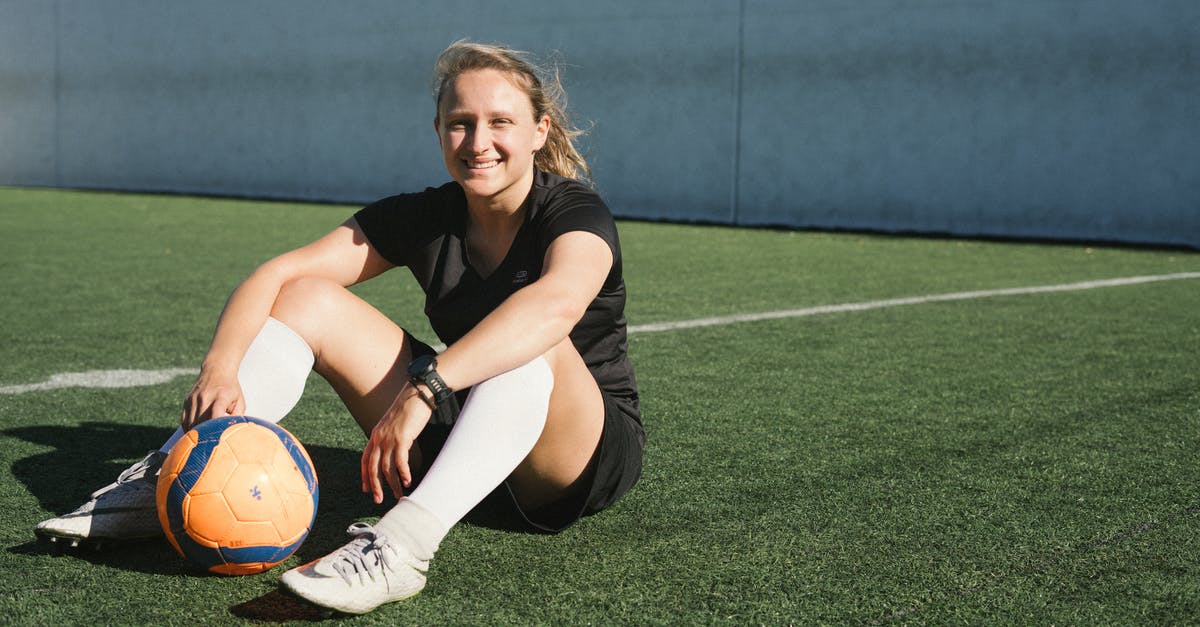 How to get football tickets for Premier League when traveling - Soccer Player Sitting On A Green Field